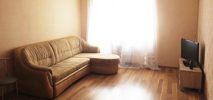 Living room with a soft sofa in a two-room suite &quot;wellcome24&quot; in kiev on the left bank. shoot for the action.