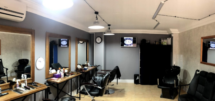 Haircut in barbershop dad + son