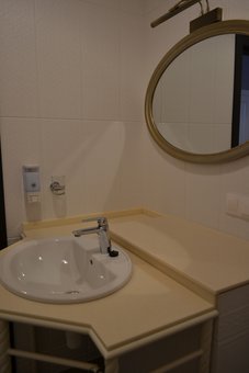 A bathroom with a shower in the room of the Michel hotel in Odessa. Book at a discount.
